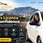 Smiling learner driver giving a thumbs up from a driving school car with L-plates – website for driving schools in South Africa